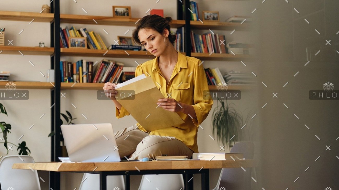 demo attachment 468 beautiful woman in shirt sitting on desk with le96bag
